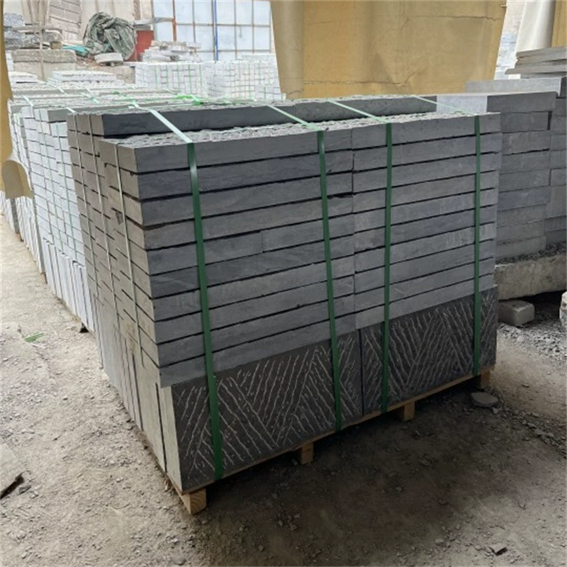 Hand-cut bluestone construction project paving roadside stone square scene area chisel road surface stone bluestone