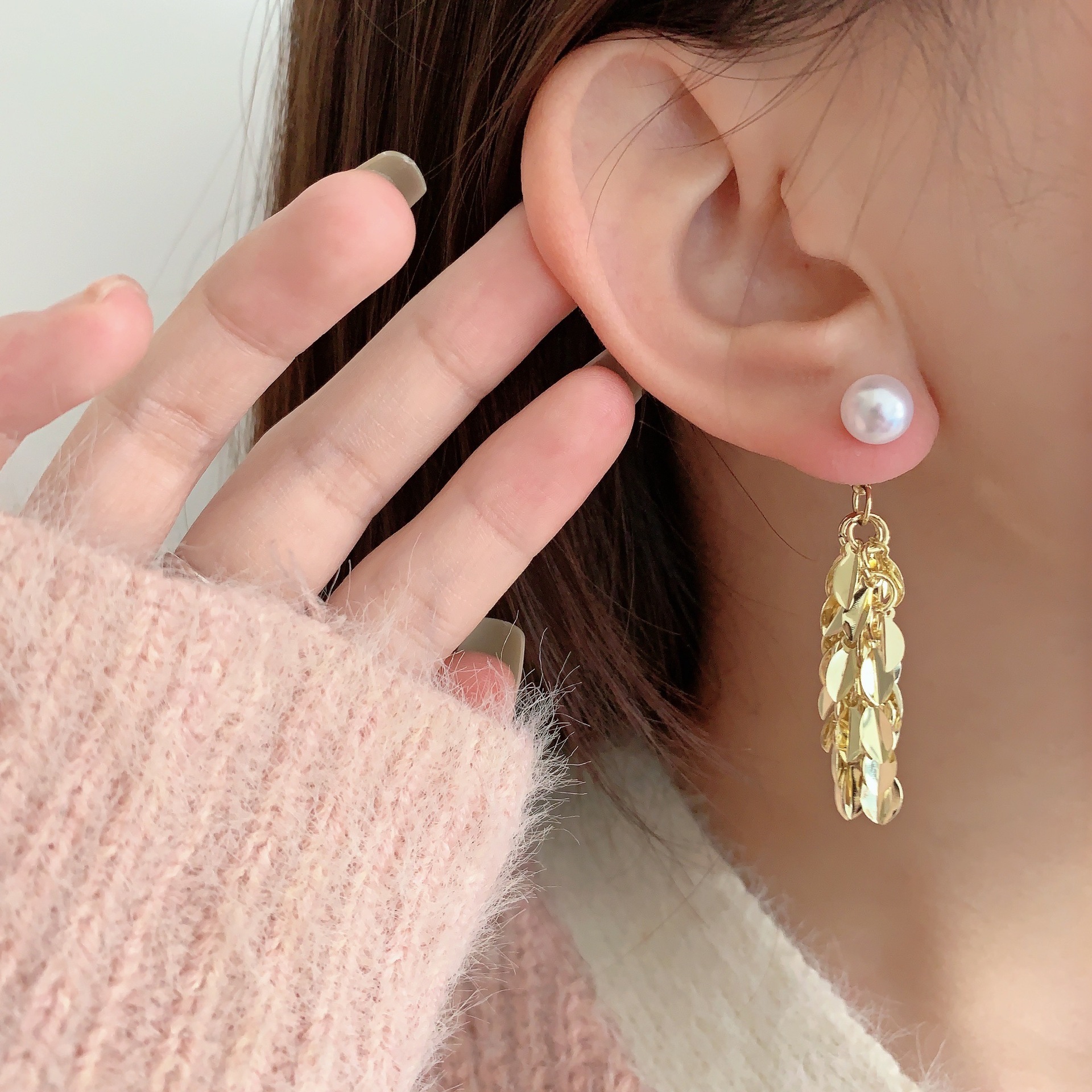 Small design elegant fashionable golden earrings with tassels from…