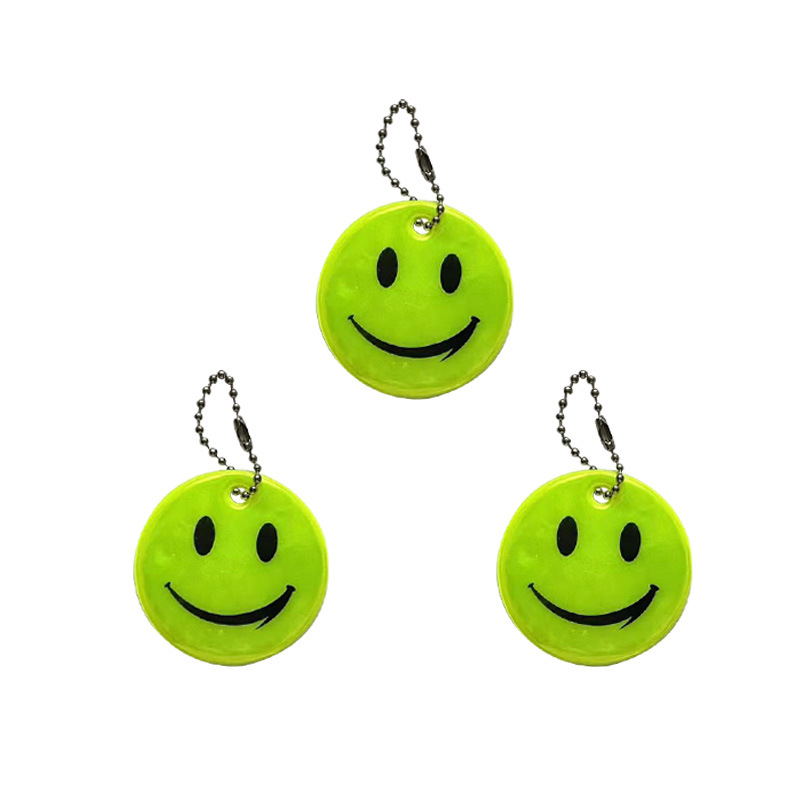 Colgante reflectante sonriente para niños viajar por la noche PVC seguro al aire libre
