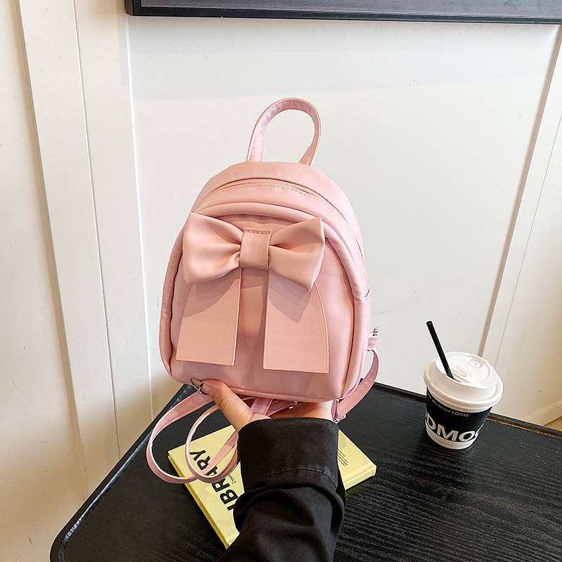 Lindo bolso pequeño con lazo simple 2025 verano nuevo estilo diseño sentido mochila pequeña moda estilo occidental mochila salvaje