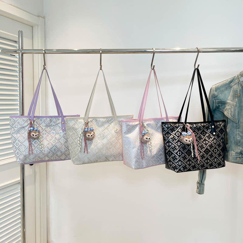 2025 nuevo estilo nacional de diseño de patrón oscuro bolso de mujer gran capacidad versátil bolso de viaje bolso de hombro de moda ligero de lujo
