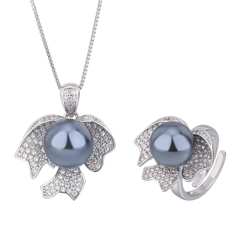 2023 Nueva Zhuang Sheng joyas de cobre de fondo chapado en oro perla joyería de moda traje de 12mm