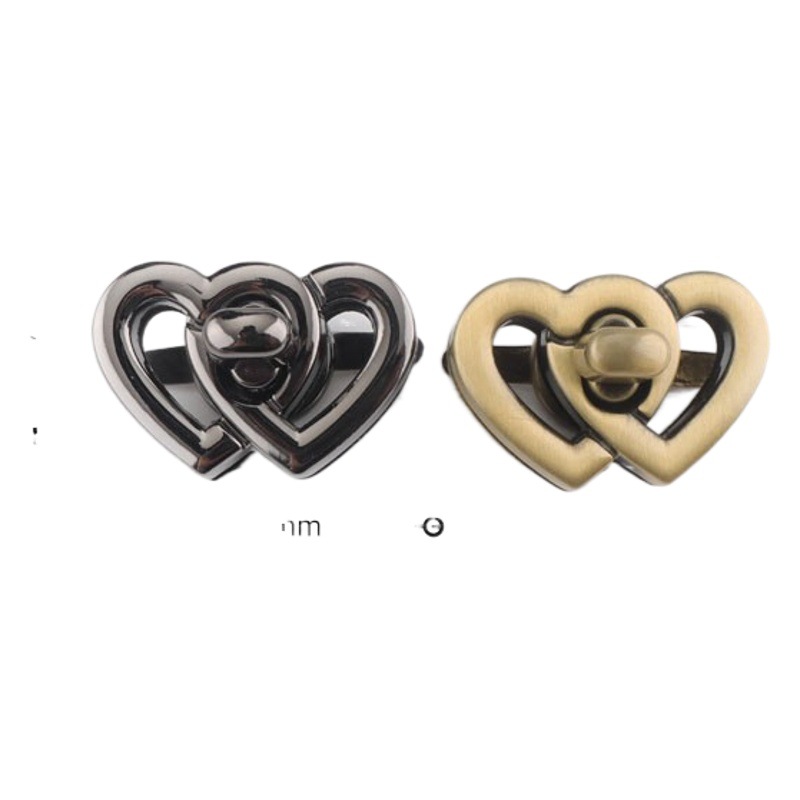 Los fabricantes suministran Bloqueo de giro de metal doble en forma de corazón bolsa de bloqueo de hardware interruptor de bloqueo de la hebilla del enchufe del bolso de las mujeres de hardware