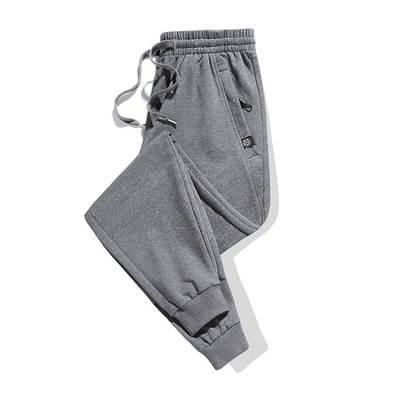 Pantalones largos casuales para hombres Otoño e Invierno Nuevos deportes estilo coreano moda en stock al por mayor pantalones de chándal con cremallera gruesa forrada de lana