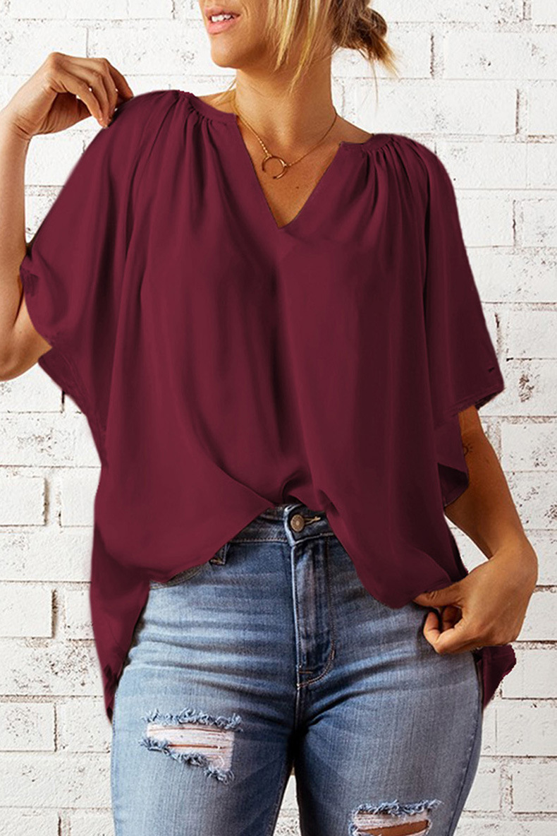 top holgado de color sólido con cuello en V y manga de cinco puntos NSQSY129321