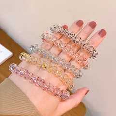 透明なネギの粉の電話線のヘアピンの卸売りのファッション的な通勤の髪の紐は団子の髪の紐の小さい皮の筋の女性を刺します。
