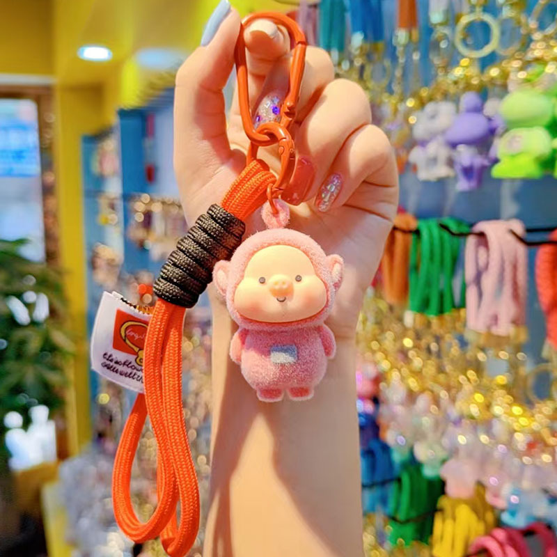 Caricatura floc amarelis llavero de automóvil pareja colgante bolsos creativos colgar garra máquina regalos al por mayor