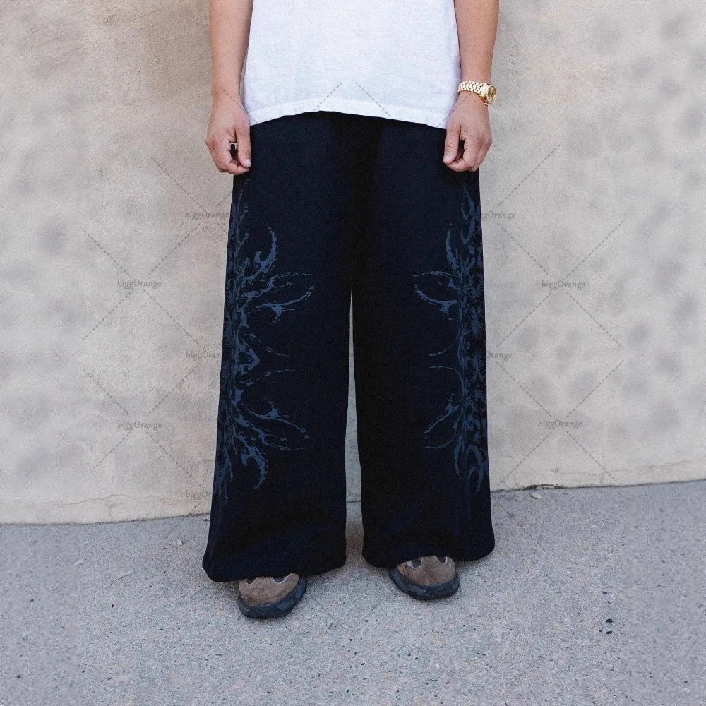 Europa y Estados Unidos transfronterizos estadounidenses tendencia hip-hop personalidad callejera pull-out pantalones casuales de moda impresa pantalones rectos sueltos