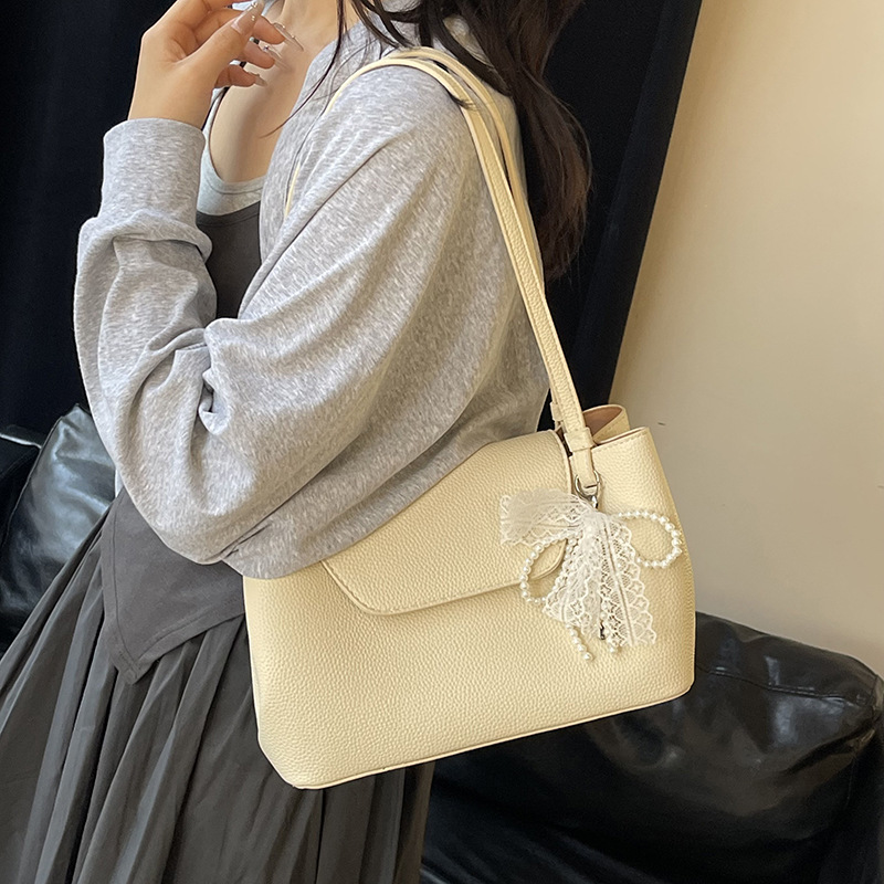 Bolso Tote de cercanías todo-fósforo de nicho retro transfronterizo para mujer 2025 primavera nuevo estilo estilo occidental bolso de axila de un solo hombro de gran capacidad