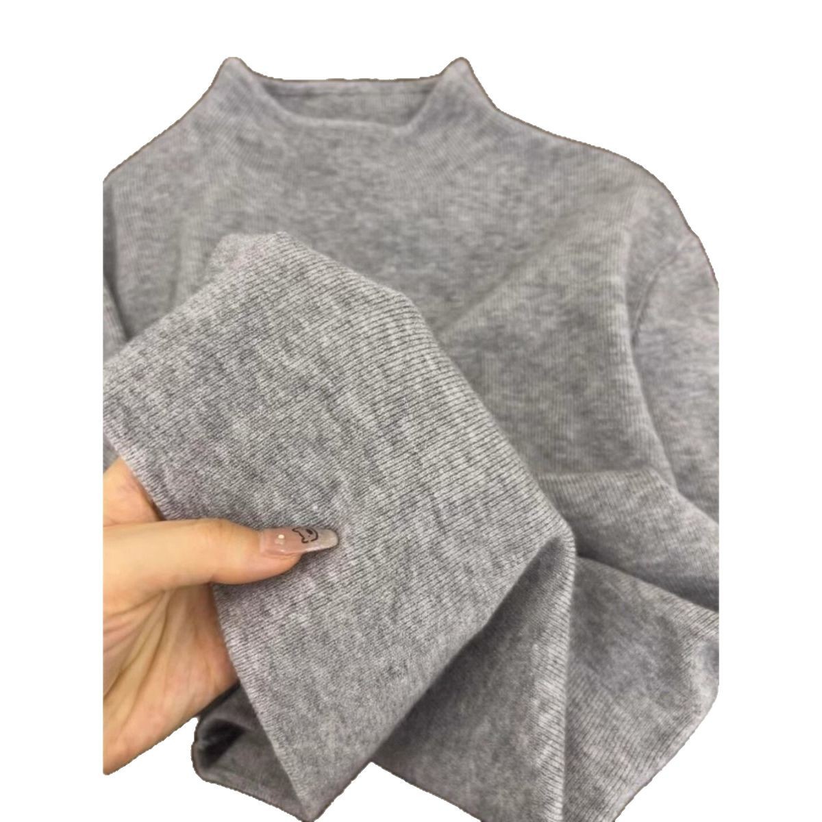 高級感の小さい立襟のセーターは底の女性の冬の修身の長袖の冬の半高襟のニットの秋冬の新型の上着を打ちます。