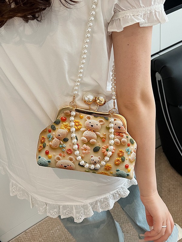 Bolso de mujer 2025 nueva impresión de tela lindo oso bolsa de cena concha de cadena de perlas bolso de mochila