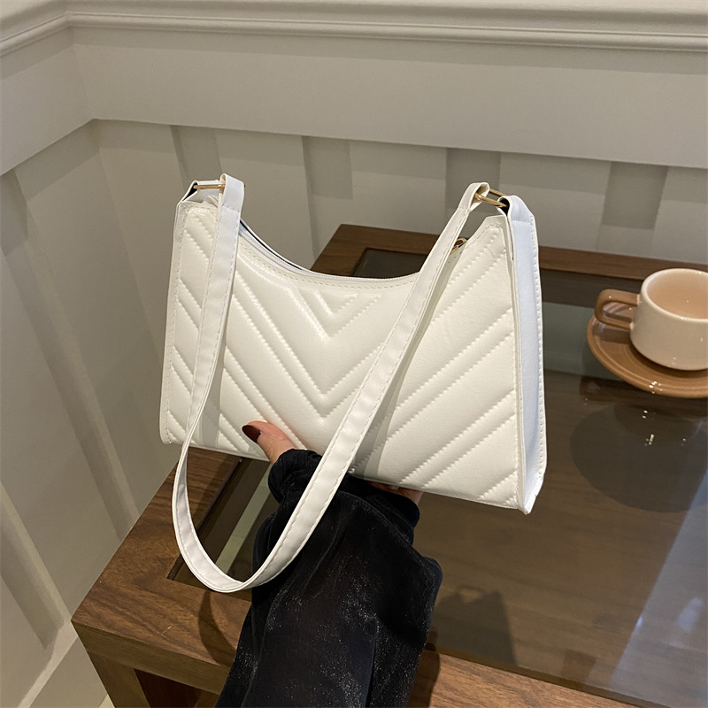 Nicho francés diseño bolso de brazaletes de diamante para mujeres 2024 verano nuevo estilo de moda de cadena universal bolso de hombro para chicas