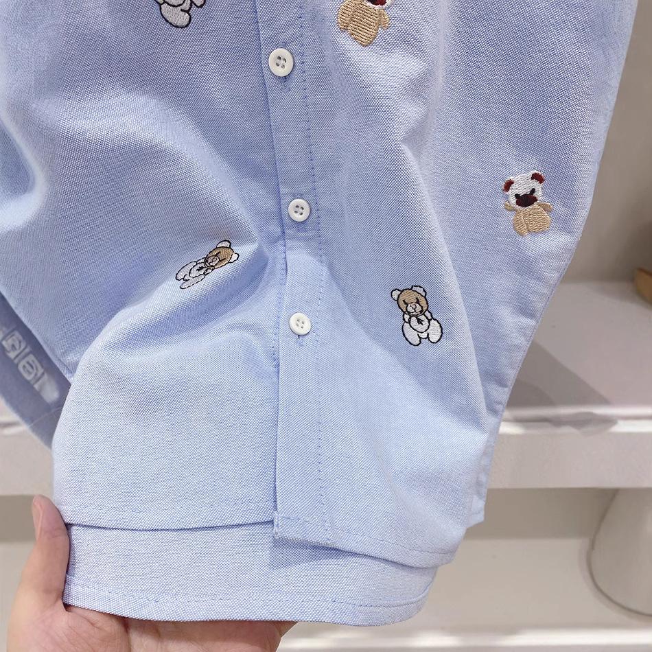 Camisa de manga larga de los niños 2023 primavera nueva camiseta de oso de dibujos animados superior camisa de estilo occidental de los niños de moda