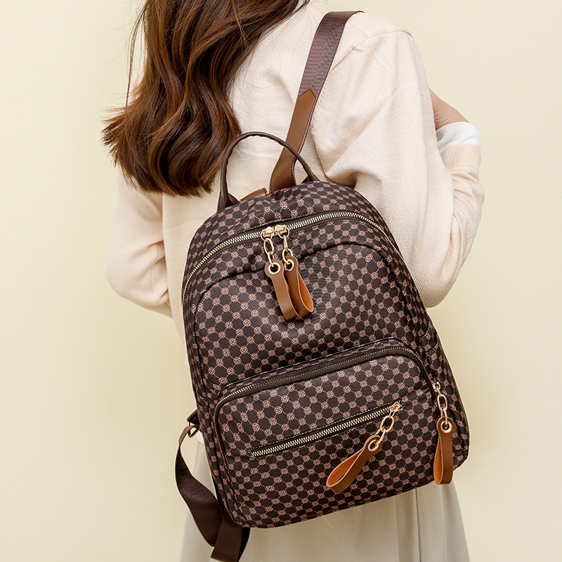 Venta al por mayor transfronteriza 2024 nueva mochila de cuero suave para mujer retro europea y americana