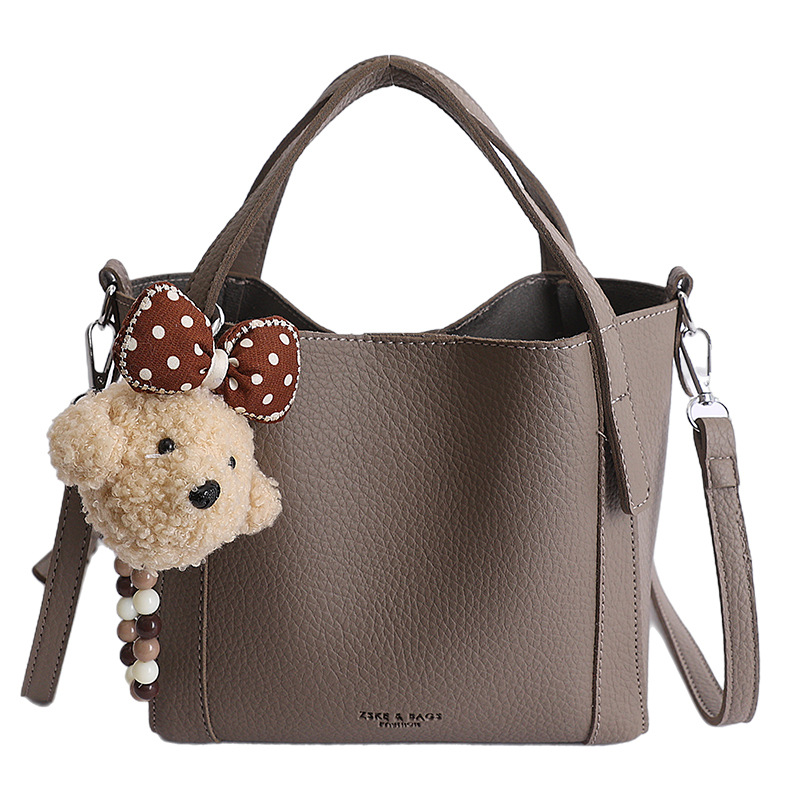 Nicho coreano litchi pattern bolso de cubo de mano mujer comercio exterior nueva moda alta textura ligera lujosa bolsa de mochila