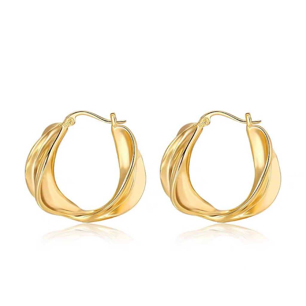 Golden metal small design earrings, trend of season