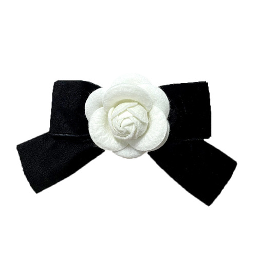 Vintage brocade ribbon butterfly knot camellia brooch with a touch of elegance, suitable for various occasions.