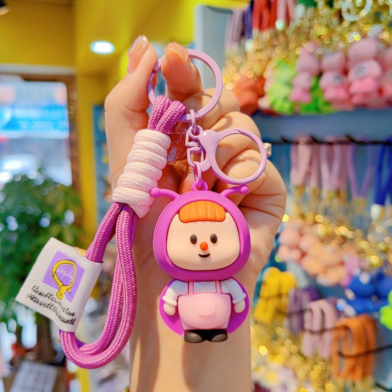 lindos dibujos animados luciérnagos llavero rojo estereoscópico muñeca de goma suave colgante de alto valor de la cara brillante pareja colgante