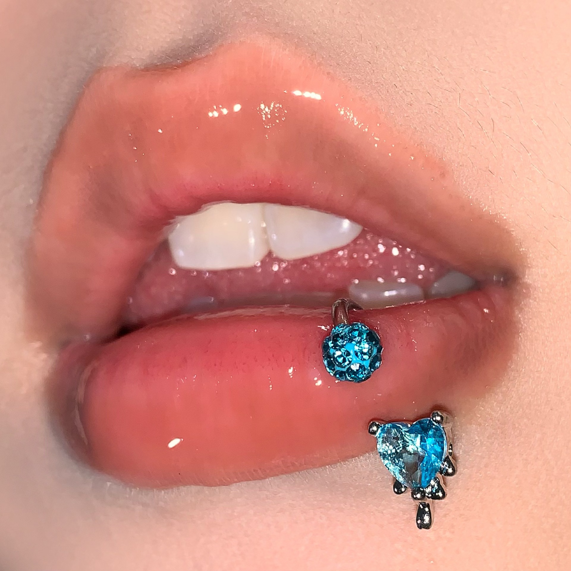 Silver pointed spike labret stud material detail