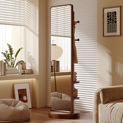 Floor-standing full-body rotating mirror for home use, suitable for bedrooms, movable, with built-in clothing rack and hanging space for clothes and hats