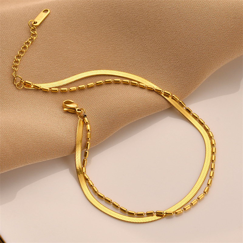 Europa y los Estados Unidos ventas transfronterizas calientes de doble capa de acero de titanio cadena de hueso de serpiente no desvanecer pulsera de alta gama para mujeres joyas de mano