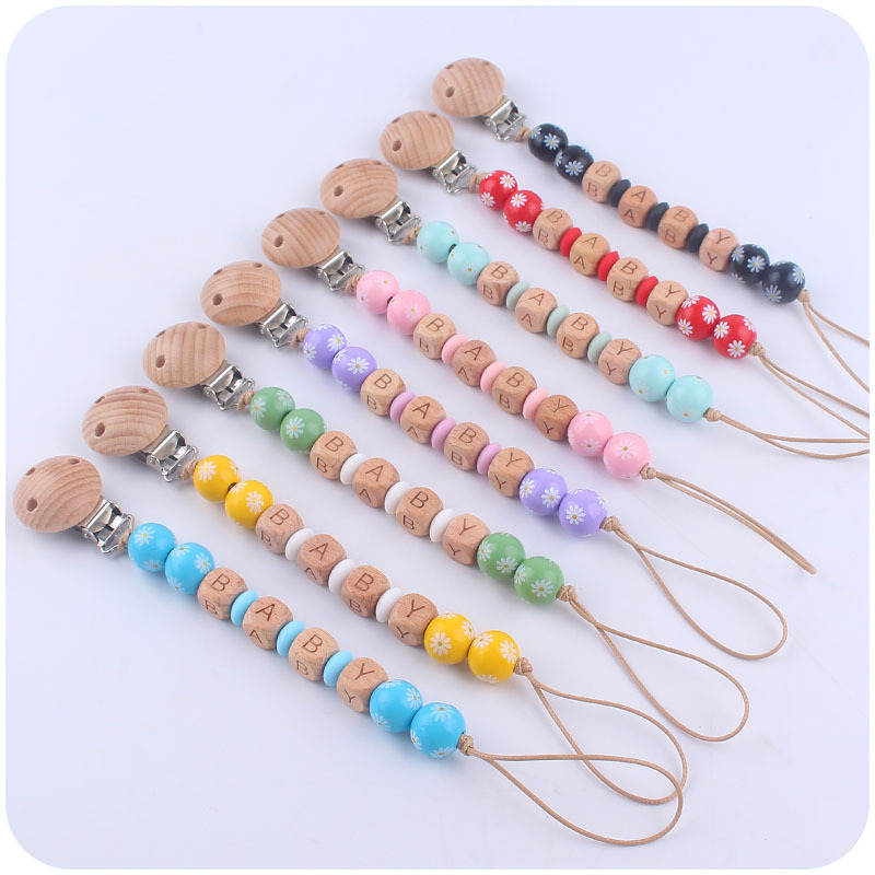 Nuevo bebé suministros dibujos animados madera Margarita cuentas pacificar bebé DIY nombre chupete cadena anti-gota cadena