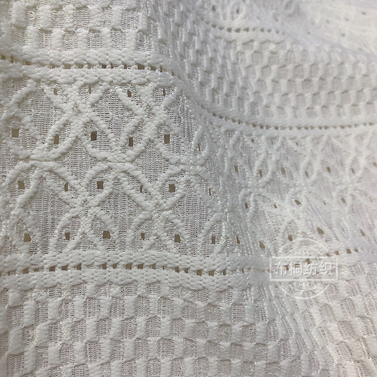 Tejido Jacquard hueco soluble en agua moda hombre camisa de punto suelta camisa texturizada tela