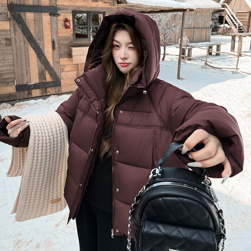 2025 invierno nuevo estilo coreano suelto y grueso abrigo de algodón de pluma caliente mujer corto con capuchón chaqueta de pan europeo