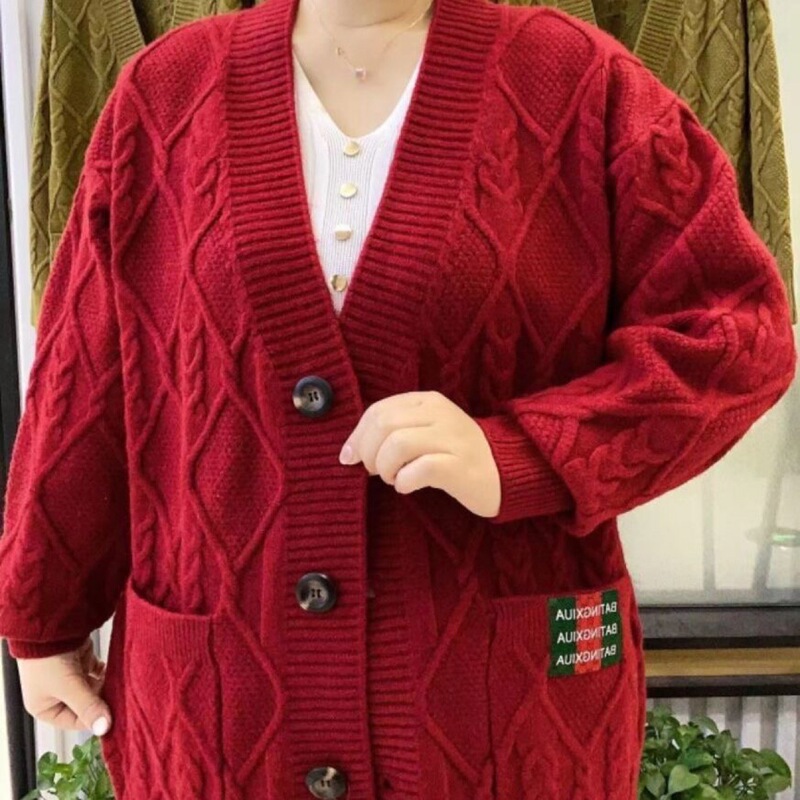 秋に太って大きいサイズのvネックのセーターの上着の新型の韓国版の太っている女性の洋風のメリヤスのカーディガンの外でマントを掛けます。|undefined