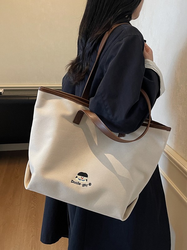 Bolsa de lona de gran capacidad para mujeres 2025 nuevo estilo urbano simple de viaje al trabajo sensación de alta calidad de moda versátil bolso de mano