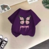 Purple T-shirt, letter T