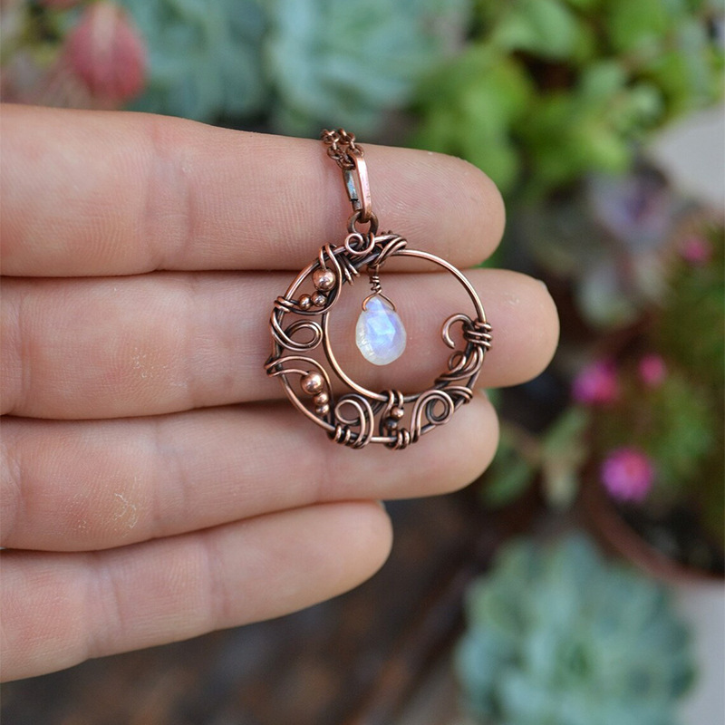 Amazon new European and American retro hollow winding copper moon pendant small water drop moonstone necklace wholesale Amazon new European and American retro hollow winding copper moon pendant small water drop moonstone necklace wholesale
