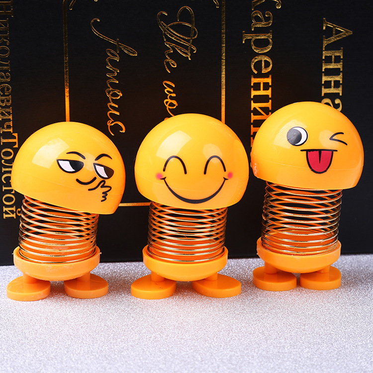 Tiktok mismo estilo sacudiendo cabeza expresión facial bolsa muñeca personalidad creativa Smiley cara coche primavera estudiante Escuela Primaria Decoración