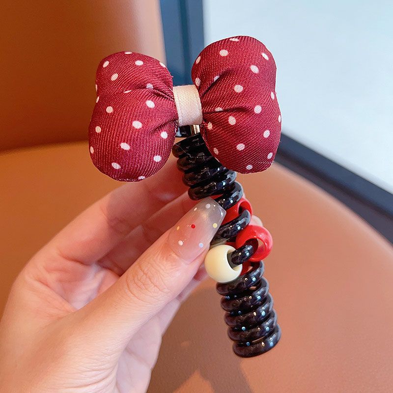 Círculo de pelo de la línea telefónica de lazo manchada roja