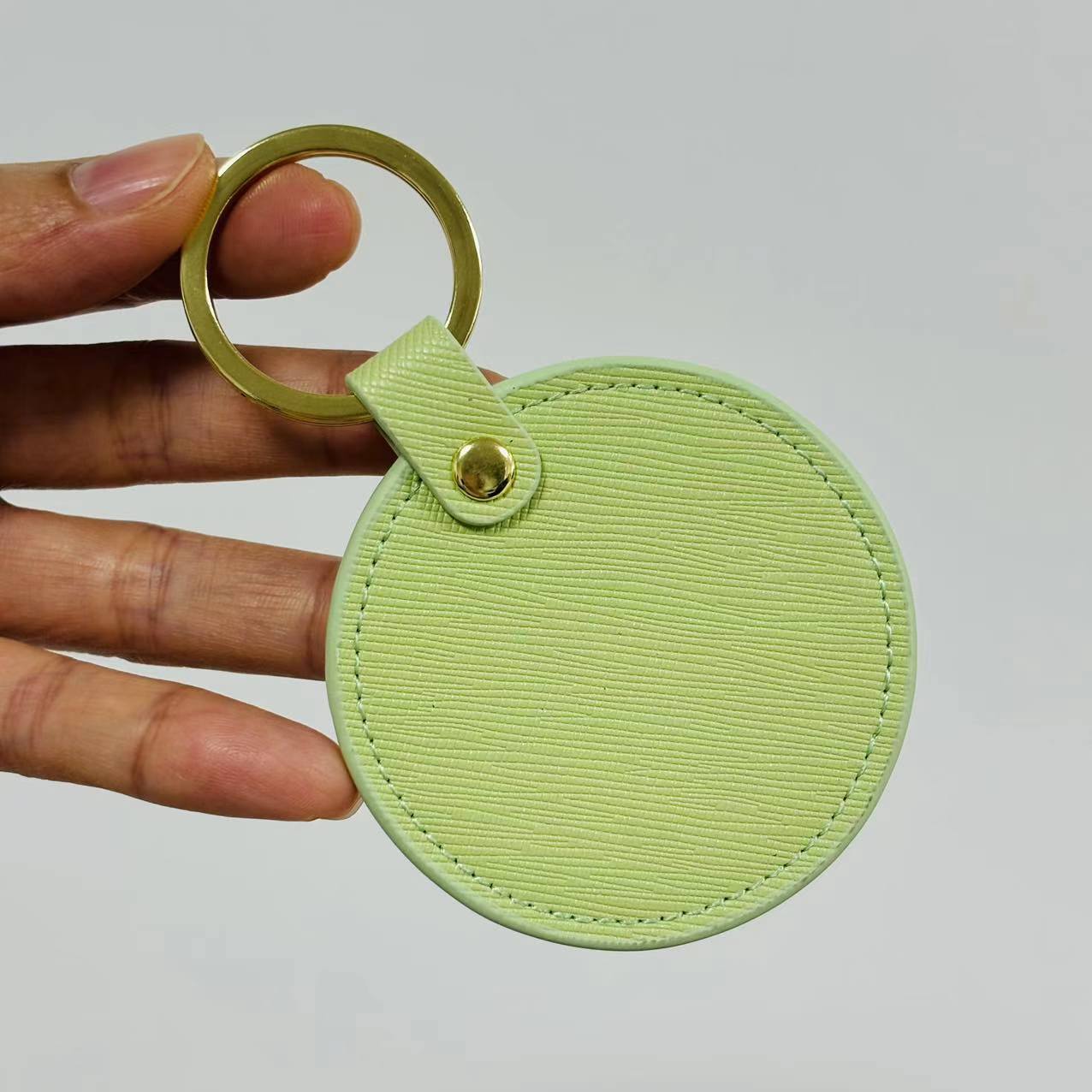 Llavero redondo de cuero genuino, colgante creativo personalizado, pequeños regalos para hombres y mujeres, regalos de negocios versátiles al por mayor