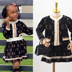 A set of two-piece knitted sweater for girls with a round neck and single-breasted button, featuring a small Shangri-La-style knit jacket in gold.