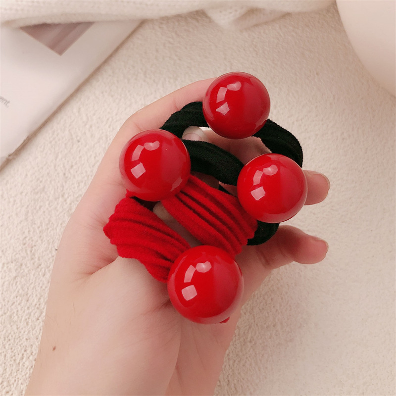 Temperamento coreano simple bola roja anillo de cabello de cabello chica cola de caballo tiras gruesas tiras elásticas cubierta tira elástica al por mayor