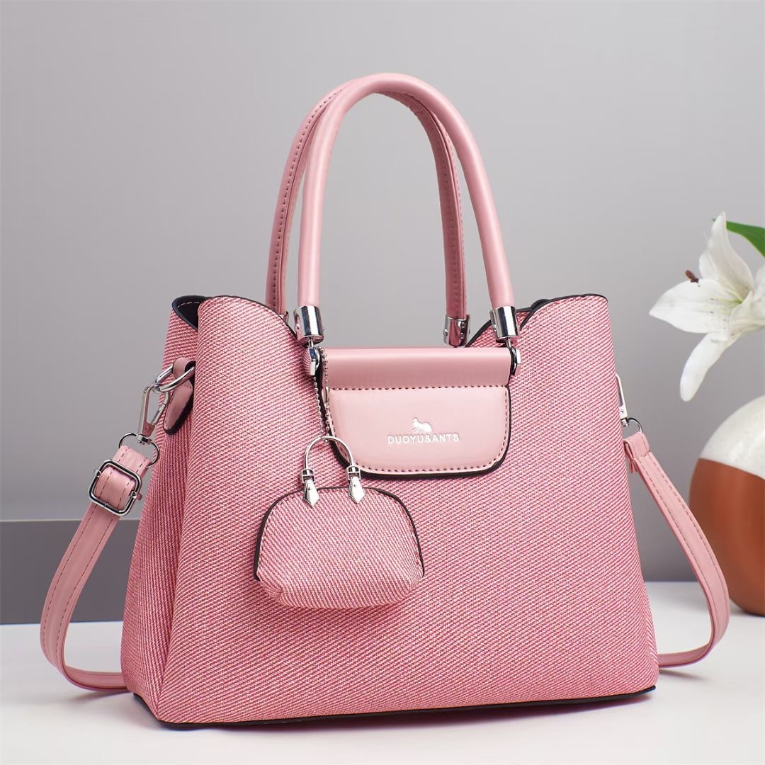 El nuevo bolso de mano para niños y madres está de moda en el bolso de hombro de textura, bolso de mensajero de diseño de nicho coreano de todo fósforo, comercio exterior