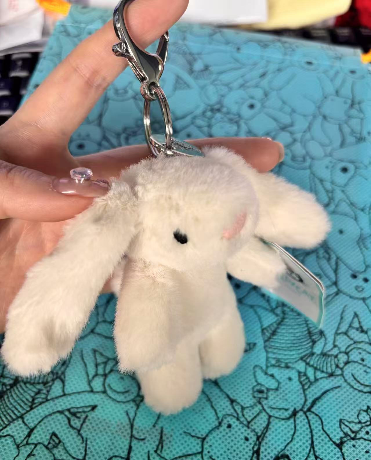 White lying rabbit pendant