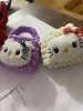 K T cat on the front; leaf ball buckle on the back