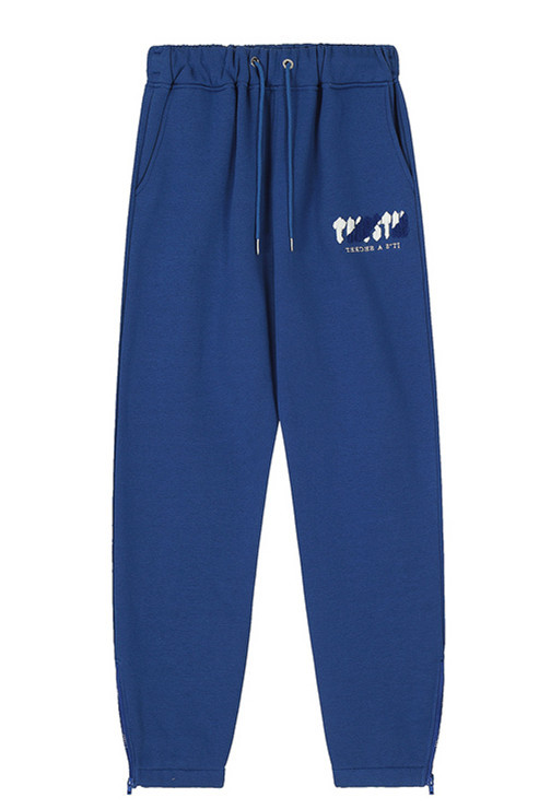 Marca de moda europea y americana Trapstar toalla azul y blanca bordada hombres y mujeres pareja pantalones casuales azules sueltos pantalones de chándal High Street