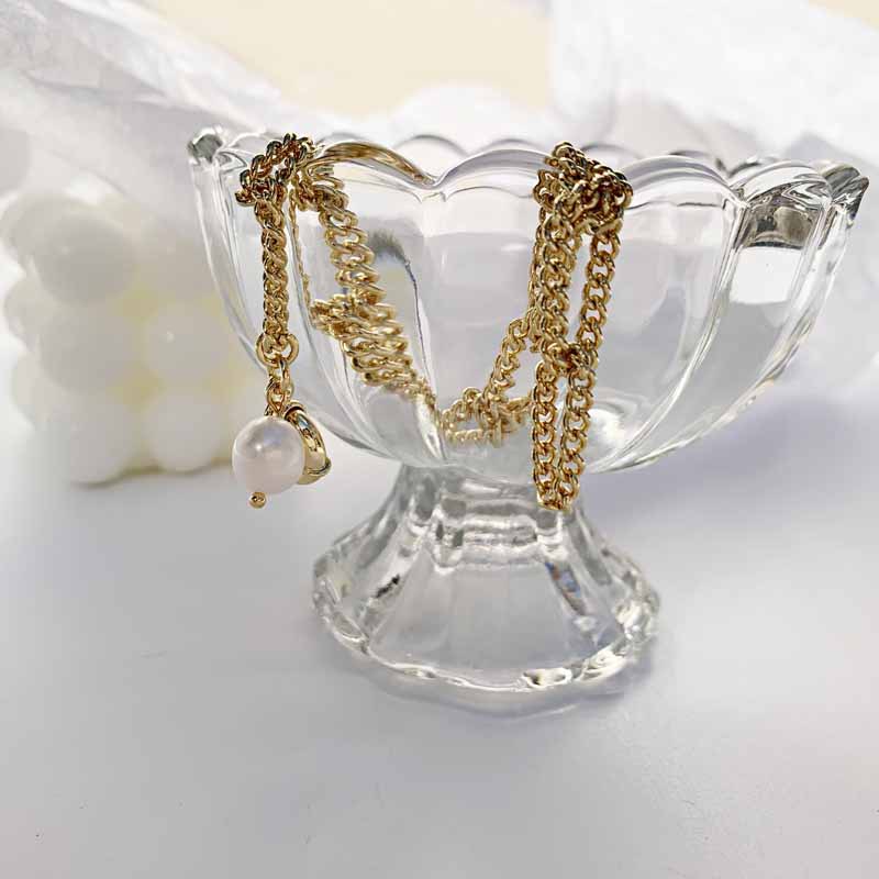 Baroque Fashion Pearl Pendant Twist Knotted Chain Copper Bracelet display picture 3