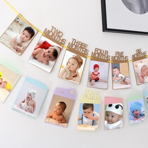 Baby's first birthday photo frame, flag decorations, floral arrangements, photo banners, dessert table decorations, floral designs