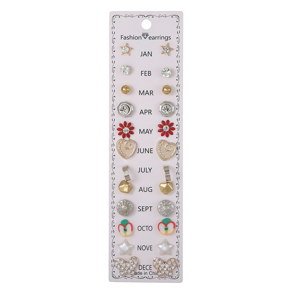 Set de 12 pares de aretes con flores y diamantes