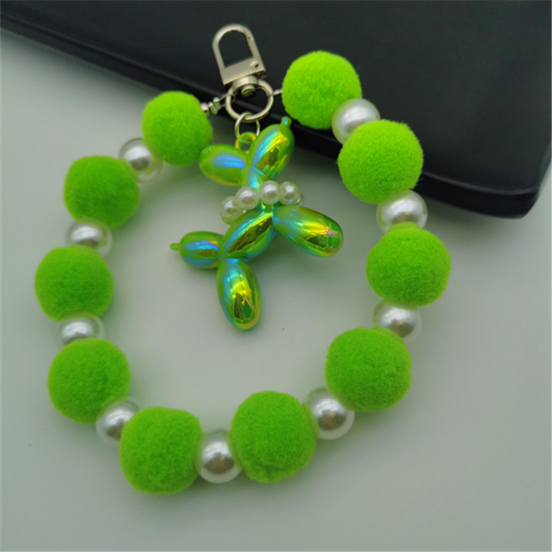 Nueva bola de piel de cadena de perlas colgante cadena de teléfono móvil ins Internet celebridad mismo estilo muñeca de invierno pulsera peluda cadena portátil