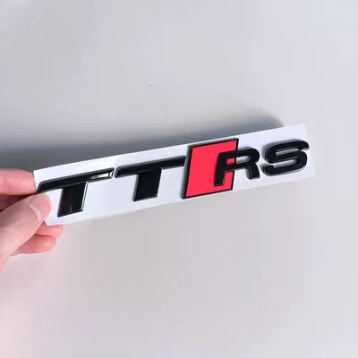Car logo: TTS black lettering, center grille