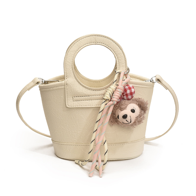 Bolso para mujeres 2026 nuevo nicho coreano de comida de mano cesta bolsa de cubo de textura alta de viaje mochila de hombro