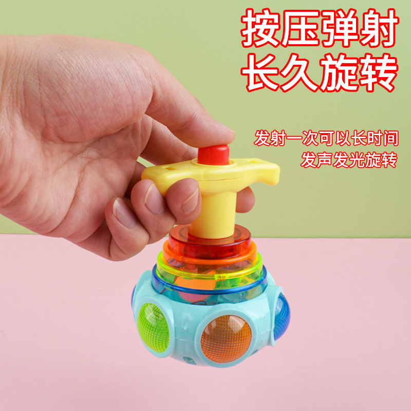 Juguete rojo neto para niños juguete emisor de luz música ligera giroscopio catapulta giratoria giroscopio emisor de luz puesto de regalo al por mayor