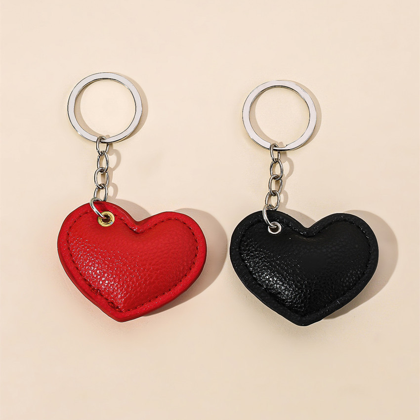 欧米の新型カップルpu愛のキーホルダー革の綿のハート型の車のキーホルダーはバレンタインデーのプレゼントのペンダントを掛けます。