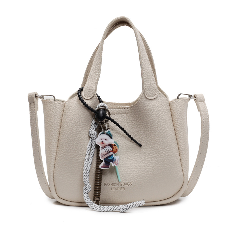 Bolso de cubo de mano transfronterizo sentido de alta gama para mujer 2025 nuevo bolso de mensajero de un solo hombro simple y versátil bolso de canasta de verduras de nicho